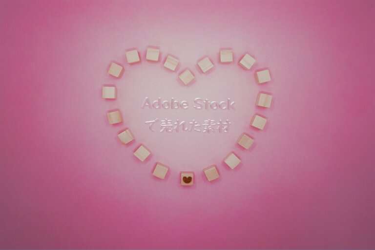 Adobe Stockで売れた143枚目の写真は「ピンクの背景でハートを丸く囲む人の輪」